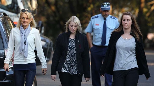 Anika Haigh (centre) the girlfriend of Gary Tweddle, with her mother Jo (left) and sister Beth at Sublime Point in the Blue Mountains, near where a body has been discovered.