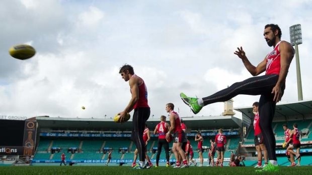 Back to the grind: Swans star Adam Goodes trains at the SCG on Tuesday after his tumultuous weekend. The Swans face  fellow high-flyers Essendon on Saturday.