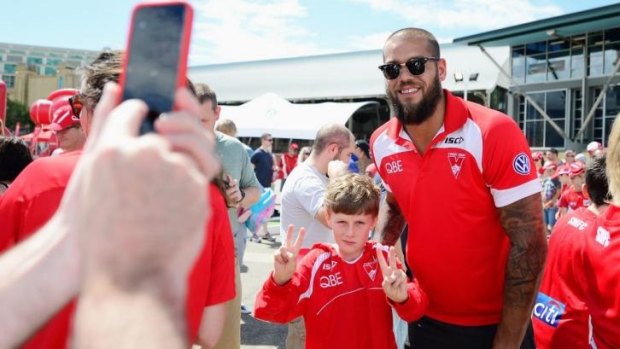 Lance Franklin poses for a photo with a young supporter during the Sydney Swans AFL Fan Day this week.
