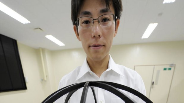 The Japanese defence researcher has invented a spherical observation drone that can fly down narrow alleys, hover on the spot, take off vertically and bounce along the ground.