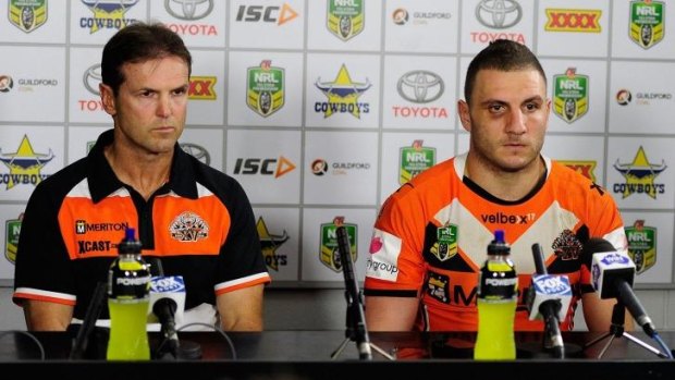 Happy days: Mick Potter and Robbie Farah front the media after the Tigers were humbled 64-6 by the Cowboys in Townsville.