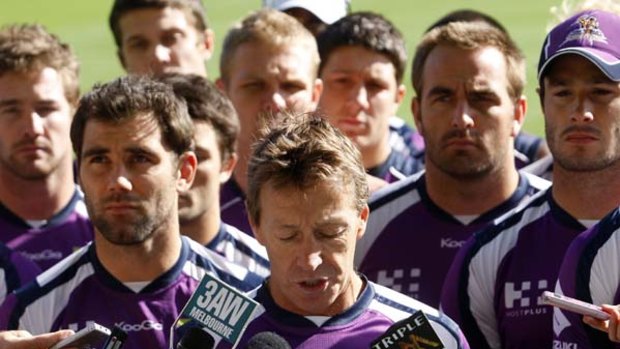 As one . . . Melbourne Storm coach Craig Bellamy and the players standing firm two days after they were stripped of their premiership titles in April.