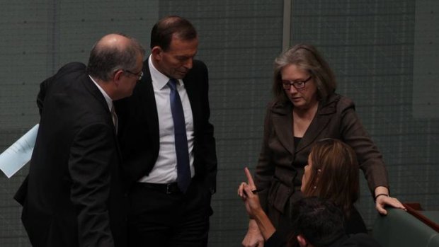 Shadow Immigration Minister Scott Morrison, Opposition Leader Tony Abbott and Judi Moylan speak with advisor Peta Credlin during the debate. Photo: Alex Ellinghausen