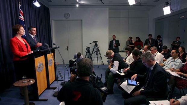 The fixer ... John McTernan watched Prime Minister Julia Gillard handle a press conference.