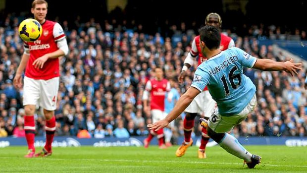 Rout: Sergio Aguero of Manchester City scores the opening goal.