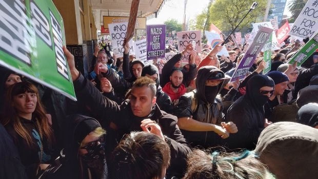 Police clash with protesters on Saturday in Melbourne.