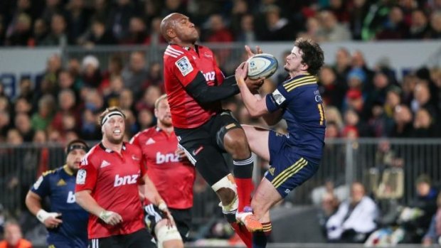Strong contribution: Crusaders winger Nemani Nadolo clashes with Richard Buckman in Christchurch.