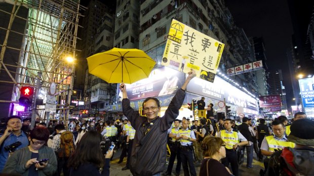 A pro-democracy protester shows a sign saying, "I want true universal suffrage", during demonstrations in Hong Kong in November 2014.