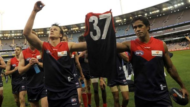 Melbourne's captain James McDonald and Aaron Davey pay tribute to the jumper of ailing club president Jim Stynes in 2009. Davey is tipped by many to become the next Melbourne captain.