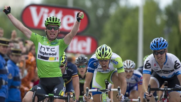 Britain's Mark Cavendish celebrates as he wins the 15th stage of the Tour de France.