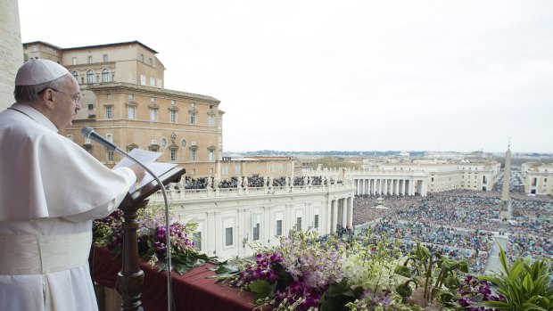 Pope Francis speaks from the balcony overlooking St Peter's Square at the Vatican in April.