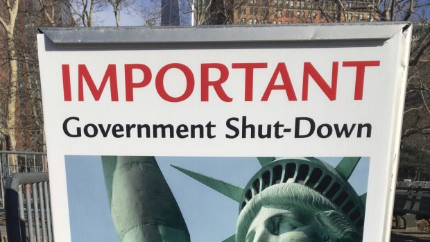 The sign at the Ellis Island ferry cue informs visitors that there was no access to the island or to the Statue of Liberty, due to the government shutdown,.