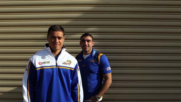 Moving on ... Parramatta duo Timana Tahu and Tim Mannah at Endeavour Foundation Industries at Seven Hills yesterday. Tahu returns to action tomorrow night.
