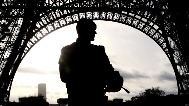 A soldier stands guard at the Eiffel Tower in Paris as France reels from a spate of suicide attacks and killings.