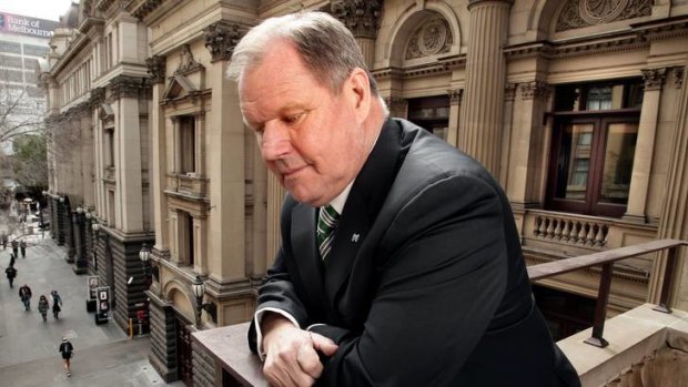 Lord Mayor Robert Doyle looks out onto Swanston Street from the balcony of the Melbourne Town Hall.