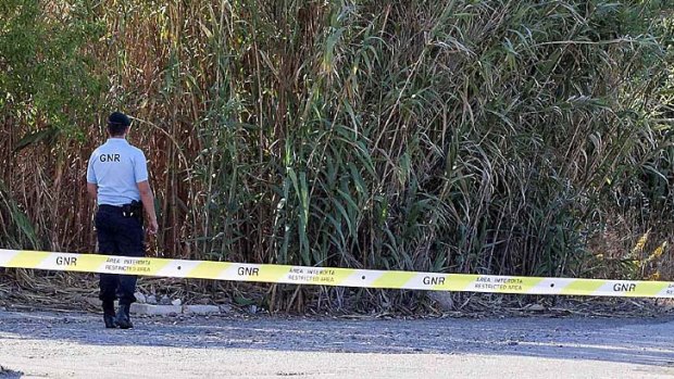 Portuguese police seal off an area of scrubland in the Portuguese resort where the three-year-old went missing.