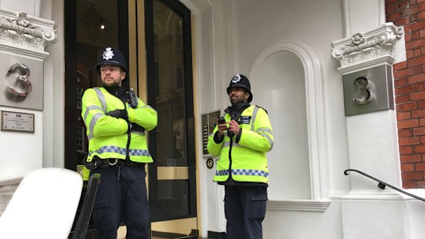 Police outside the Ecuadorian embassy on Monday.