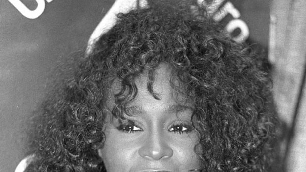 "Peerless voice" ... Whitney Houston smiles at a news conference in New York in 1988.