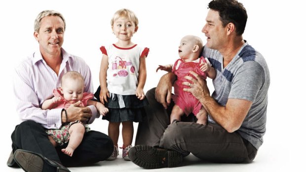 Family affair … Queensland couple Dean (at left) and David with their three girls.