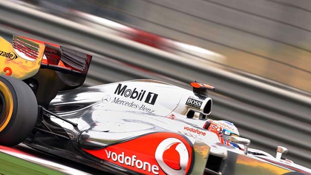 McLaren-Mercedes driver Jenson Button of Britain finished second despite a pit-lane mishap.