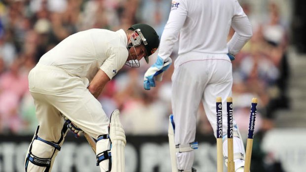 Brad Haddin is bowled by Jonathan Trott.