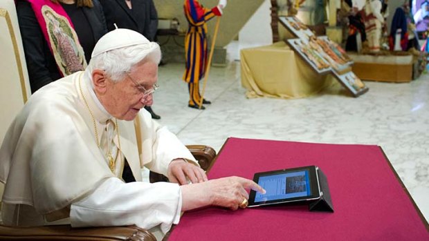Tweeting up a storm ... Pope Benedict XVI posts his first tweet using an iPad.