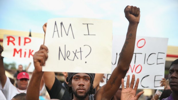 Protesters take to the streets in Ferguson in August.