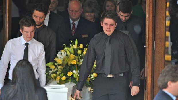 Bridget Jones' coffin is carried from the church.
