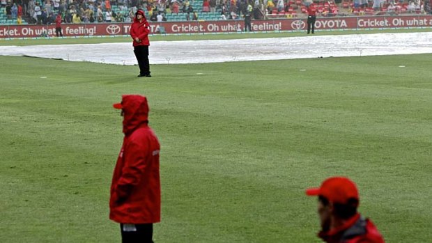 Soggy finish: The SCG under water.