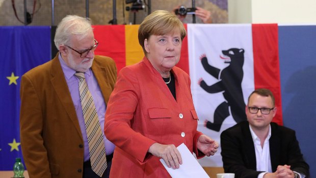 Angela Merkel, Germany's Chancellor and Christian Democratic Union (CDU) leader, casts her vote.