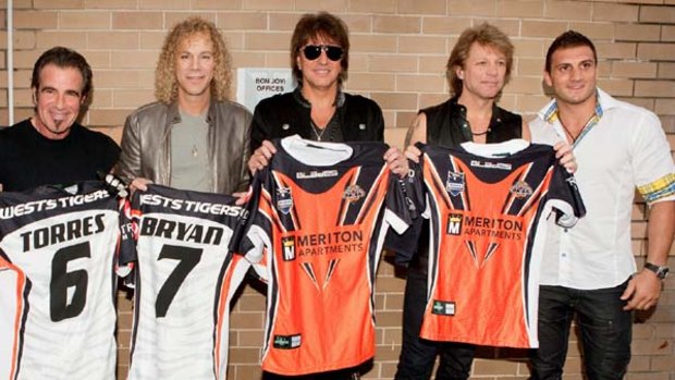 Robbie Farah presents the band with signed jerseys in Sydney.