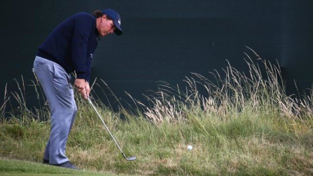 Phil Mickelson hits a pitch shot on the third hole during the second round of the British Open on Friday.