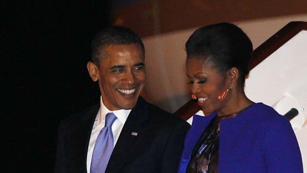 Landed safely ... US President Barack Obama and his wife  Michelle arrive at Stansted Airport.