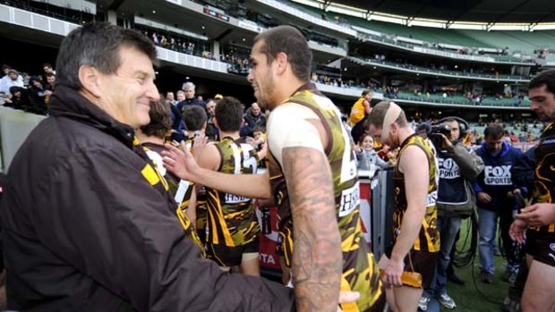 Happier times. Hawthorn president Jeff Kennett greets his charges after they defeated Sydney by two points in round ten at the MCG.