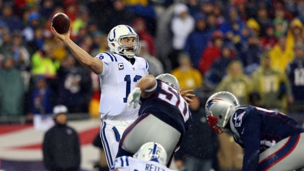 Deflated: Indianapolis Colts Andrew Luck looks to throw a pass against the New England Patriots in the 2015 AFC Championship Game at Gillette Stadium.
