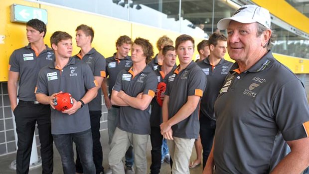 Meeting the boss: Kevin Sheedy (right) stands in front of his new recruits, Greater Western Sydney's first draft picks.