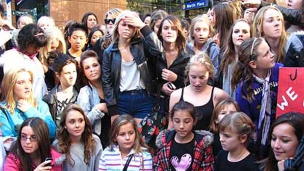 Disappointed fans wait outside Channel Seven's studio in Martin Place.