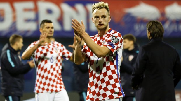 Almost there: Ivan Rakitic salutes the crowd after Croatia's easy win in the first leg.