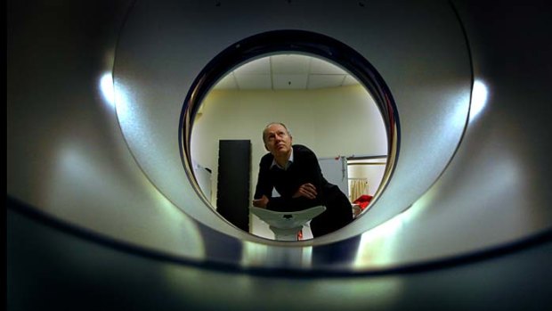 Professor Rod Hicks with the Peter MacCullum Cancer Centre's PET scanner
