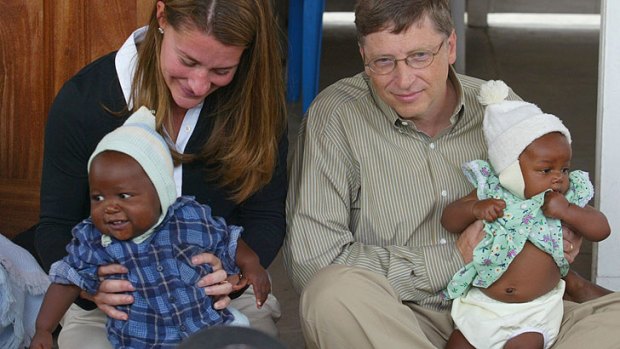 Bill and Melinda Gates hold babies during their visit to the Manhica Health Research Centre in Mozambique in 2003.