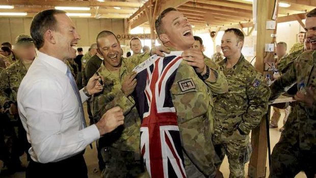 Abbott meets with troops.