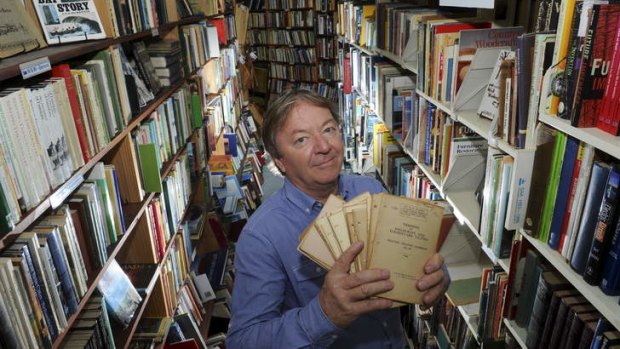 Simon Maddox in his Beyond Q Bookshop in Curtin, with some of the military doctrine   training pamphlets.