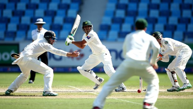 Younis Khan sets off after finding a gap.