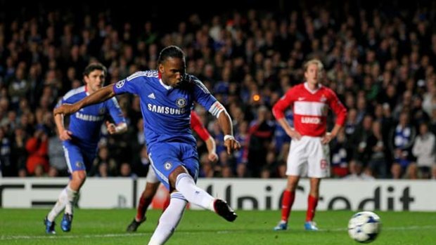 Captain's knock . . . Didier Drogba slots home from the spot.