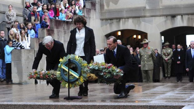 Prime Minister Kevin Rudd, his wife Therese Rein and Opposition Leader Tony Abbott lay wreaths during the last post ceremony. Photo: Melissa Adams