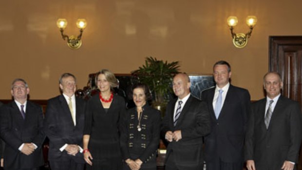 Professor Marie Bashir, the Governor of NSW, and the NSW Premier,  Kristina Keneally, at Government House yesterday for the swearing in of new state government ministers. From left: Peter Primrose; Paul Lynch; the new Transport Minister, John Robertson; David Borger  and Frank Terenzini.