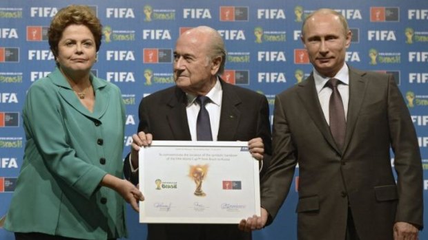 Political project: Brazil President Dilma Rousseff (left), FIFA President Sepp Blatter (centre) and Russian President Vladimir Putin at the World Cup handover ceremony.