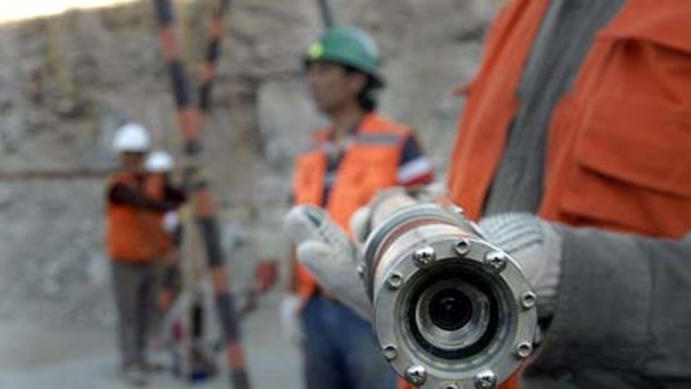 Watching the trapped miners ... this video camera is sent down a 700m shaft.