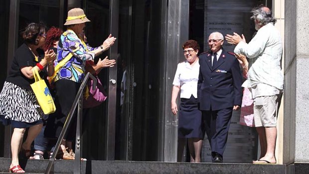 Whistleblower: Salvation Army major Cliff Randall is applauded as he leaves the royal commission after giving evidence about the church's Indooroopilly boys' home.