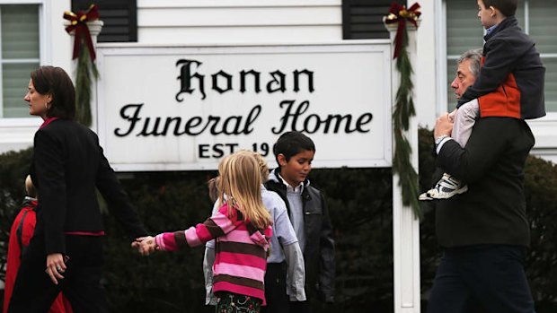 People attend the funeral for Jack Pinto.